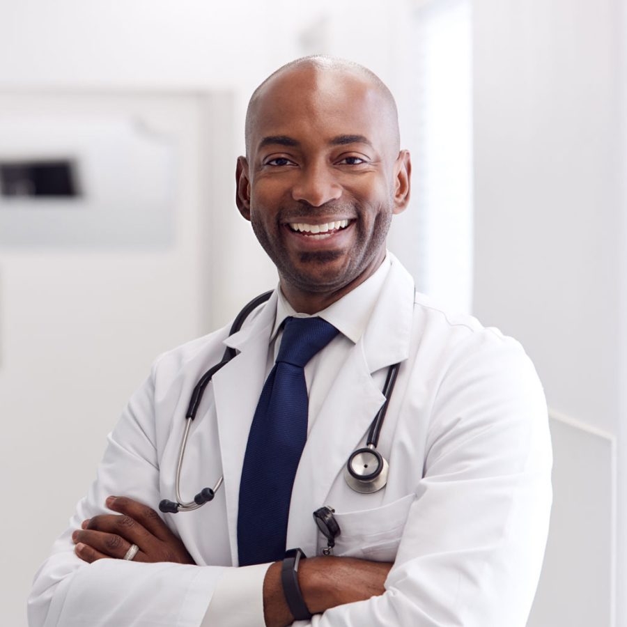 portrait-of-mature-male-doctor-wearing-white-coat-H49URGD-1.jpg